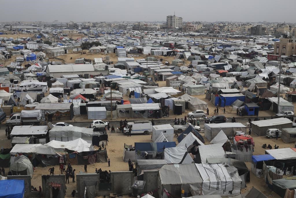 A tent camp housing Palestinians displaced by the Israeli offensive is seen in Rafah, Gaza Strip, Tuesday, Feb. 27, 2024. (AP Photo/Hatem Ali)